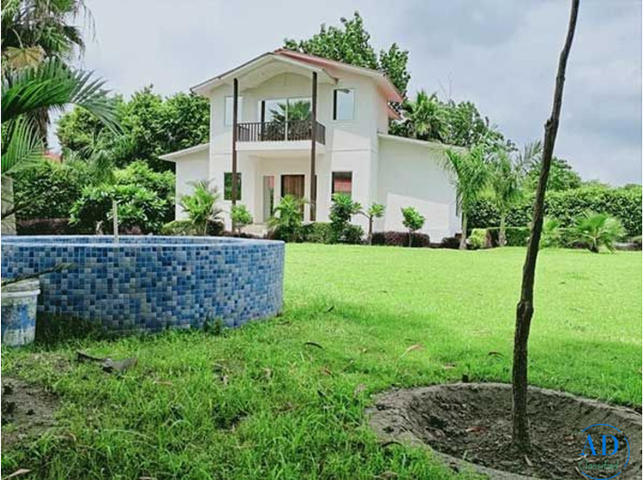 Why is purchasing a farmhouse a better long-term investment than renting?